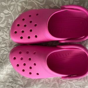Pink Crocs, size 6. Worn a few times, look like new!
